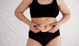front view of a woman touching her belly