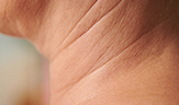 wrinkles on the neck of a mature woman aging