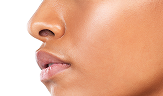young woman looking into distance studio shot